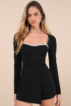 You'll make any night instantly more chic with a look like the Lulus Fashionable Sparkle Black Rhinestone Long Sleeve Skort Romper! Stretchy crepe knit shapes this skort romper with long sleeves that frame a princess-seamed bodice with a subtle sweetheart neckline, trimmed with sparkling rhinestones. High, fitted waist sits atop hidden shorts that boast a cute skirt overlay. Hidden back zipper/clasp. Fit: This garment fits true to size. Length: Above mid-thigh. Size medium measures 31" from shoulder to hem. Inseam: 2.75 Front Rise: 13.50 Bust: Great for any cup size. Waist: Fitted - very fitted at natural waist. Hip: Loosely Fitted. Undergarments: May be worn with a strapless bra, adhesive bra, petals, or no bra. Fabric: Fabric is very stretchy. Bodice and skirt are lined. Shell: 95% Polye Stretch Short Party Dress, Elegant Short Mini Dress For Night Out, Elegant Mini Length Party Jumpsuits And Rompers, Elegant Short Mini Dress For Party, Elegant Mini Length Jumpsuits And Rompers For Party, Elegant Mini-length Party Jumpsuits And Rompers, Elegant Mini Length Jumpsuit For Party, Elegant Mini Dress For Party, Fitted Jumpsuits And Rompers For Dinner