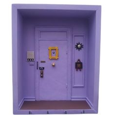 the door is painted purple and has decorations on it