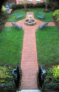 a brick path leads to a small courtyard