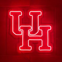 a neon sign with the letter h on it