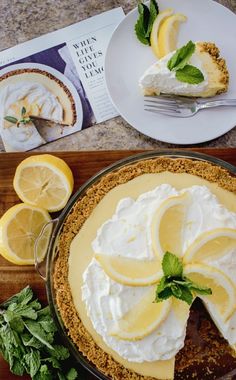 a pie with lemons and whipped cream on top