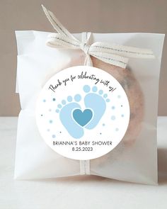 a baby shower cookie in a bag on a table