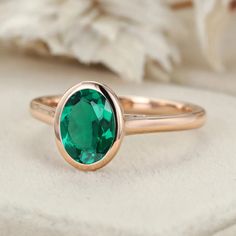 Discover timeless elegance with our Classic Solitaire 8x6mm Oval Cut Bezel Emerald Ring for Women in 14K Rose Gold, a symbol of style and sophistication. Bezel Ring, May Birthstone, Affordable Jewelry, Emerald Ring, Ring For Women, Lab Diamonds, Oval Cut, Custom Jewelry, Ring Designs