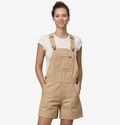 Overalls meet our beloved Stand Up® Shorts. Comfortable, versatile and made for getting dirty in the garden, they are constructed with our classic 100% organic cotton Stand Up canvas; inseam is 5". Made in a Fair Trade Certified™ factory. 100% Organic Cotton Canvas Made of 100% organic cotton woven into a timeless 9.5-oz canvas Short Length Traditional Overall Bib Traditional overall bib in a shorts-length version with Stand Up pocket details Chest Pocket has Two Drop-In Spaces and One Zippered Stylish Overalls, Cute Overalls, Local Market, Shank Button, Firepit, Woman Standing, Patagonia Womens, Outdoor Outfit, Pocket Detail