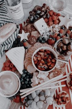 a table topped with lots of food and drinks