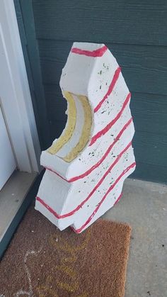 a stack of bricks sitting on top of a door mat