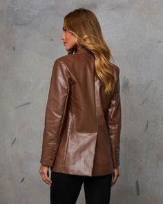 Make a statement this season with effortless, elevated style in the Edgy Feeling Faux Leather Blazer. This standout piece features smooth faux leather with a singular front button closure and padded shoulders, exuding confidence and structure effortlessly. Perfect for layering over cozy knits or sleek turtlenecks, this blazer is your go-to for embracing autumn with a chic, edgy twist. Smooth faux leather fabric Singular front button closure Padded shoulders Front flap pockets Buttoned cuffs Back vent Shell : 55% Polyester 45% Polyurethane Lining : 100% Polyester Fall Formal Leather Jacket With Snap Buttons, Leather Blazer With Snap Buttons For Office, Formal Fall Leather Jacket With Snap Buttons, Chic Leather Blazer With Snap Buttons, Formal Leather Jacket With Snap Buttons For Fall, Office Leather Blazer With Snap Buttons, Tailored Leather Jacket For Fall, Sleek Faux Leather Blazer For Winter, Sleek Faux Leather Winter Blazer