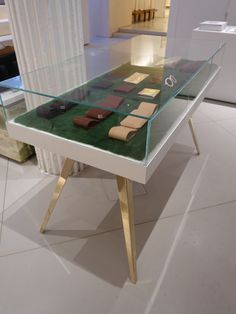 a glass table with various items on it