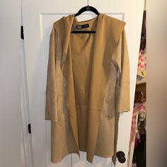 Never Worn. Suede. Perfect Condition. Belt To Tie To Close It Camel Long Coat With Pockets, Casual Long Camel Coat, Chic Camel Outerwear With Pockets, Spring Camel Long Coat, Camel Long Coat For Spring, Hooded Brown Outerwear For Work, Brown Hooded Outerwear For Work, Long Camel Coat For Spring, Chic Brown Long Sleeve Outerwear