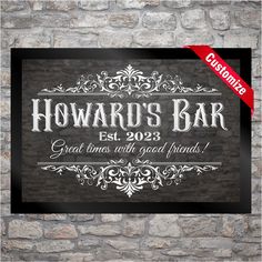 a black and white sign that says howard's bar on the side of a brick wall