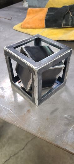 This is an extremely fun DIY welding kit that includes parts for a 3 inch cube, a 4 inch cube, 7 inches of 1/4" rod and 3 triangle sides to create a geometric stand. The builder will have to make the 3 inch cube fit inside the 4 inch cube and use the rod to balance it perfect then weld up so it Spins inside. Great for MIG or TIG welders. Parts are raw and need to be cleaned up. Includes all parts necessary to build. Cut the 1/4" rod in half and tack on opposite corners. balance it perfect and th Welding Jig, Cool Welding Projects, Metal Welding Art, Welding Cart, Tig Welder, Diy Welding, Door Design Modern, Tig Welding, Welding Art