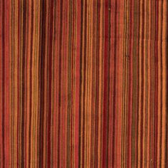 an orange, red and brown striped rug with vertical stripes on the bottom half of it