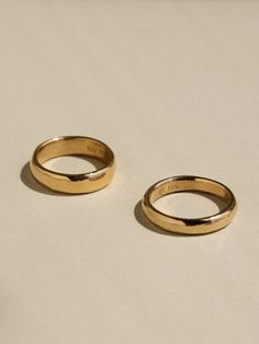 For those who appreciate the unique softness that comes from a hand crafted ring, we offer timeless gold bands carved just for you. Using only hand tools, we'll carve your ring in wax and then have it cast into gold using the ancient technique of lost wax casting. Our Sculpted Bands are made one at a time by traditional methods, show signs of their creation, and are truly one of a kind. The top of the band has a generously rounded dome, measuring a full 2mm in height, and the inside has a subtle Heirloom 14k Gold Wedding Band Thick Shape, Heirloom Yellow Gold Wedding Ring With Thick Band, Classic Gold Bands For Promise, Classic Promise Dome Ring, Classic 14k Stamped Couple Rings, Gold Couple Rings With Polished Finish For Promise, Heirloom 14k Gold Couple Promise Rings, Gold Hand Forged Round Band Rings, Yellow Gold Thick Band Jewelry For Promise