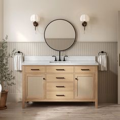 a bathroom with two sinks and a round mirror above the sink is surrounded by wood paneling