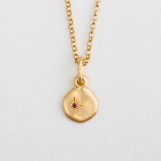 Yellow Gold Cloud Pendant made of 14k / 18k gold and ruby.For our cloud pendant, we've selected one precious natural gem and set it within a small star. The uneven surface of the pendant makes it particularly soft and appealing. Materials: 18k Yellow / 14k rose solid gold.Cloud diameter: app. 9 mm  (0.35'' inches).Ruby parameters: a natural red ruby; Round; 0.15 ct.Finish: Matte / High polish.Whether around the neck, close to the heart, or lower – our pendants always hang close, rocking with us Cloud Pendant, Wedding Pendant, 18k Gold Necklace, Gold Disc, Mom Jewelry, Valentines Day Gifts For Her, Disc Pendant, Charm Pendant Necklace, Valentines Jewelry