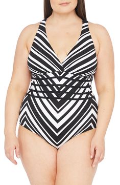 Feel every inch the beach bombshell in this black swimsuit with a deep surplice neckline, figure-sculpting bands across the midsection and a strappy back. Style Name:La Blanca Island Goddess One-Piece Swimsuit (Plus Size). Style Number: 5962377. Available in stores. Black V-neck Lined Swimwear, Black Lined V-neck Swimwear, Black Swimwear With Crisscross Straps, Black Crisscross Swimwear For Poolside, Black Triangle Top Lined Swimwear, Black Lined Triangle Top Swimwear, Black Crisscross Swimwear For Beachwear, Crisscross Swimwear With Wrap-around Straps, Black Crisscross Swimwear Beachwear