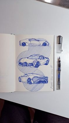 an open book with drawings of cars on it and a fountain pen next to it