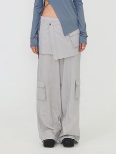 This is a modern and casual cargo pants by DIAGONAL that is made out of high quality and sturdy fabric. With unique design detail and trendy mood, you can style it for your clean and casual daily outfit.- Detachable skirt layered- Cargo pockets detail- Logo string on the hem- Logo snaps and YKK zipper Gray Spring Cargo Pants With Multiple Pockets, Gray Utility Cargo Pants For Spring, Spring Gray Utility Cargo Pants, Gray Cargo Bottoms For Workwear, Modern Spring Cargo Pants With Cargo Pockets, Gray Cargo Style Parachute Pants For Spring, Modern Spring Cargo Pants With Pockets, Detachable Skirt, Casual Cargo Pants