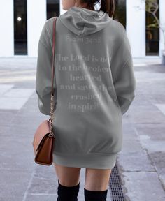 A comforting and uplifting women's Hoodie Dress featuring a biblical quote. Perfect for those seeking inspiration and positivity in their everyday wear. Ideal for religious holidays and events. Product features - 100% polyester fabric for durability and quick drying - Spacious kangaroo pouch pocket for warmth - All over print for a unique design - Hood with drawstring for adjustable fit - Medium heavy fabric with shiny finish Care instructions - Do not dryclean - Iron, steam or dry: low heat - Tumble dry: low heat - Do not bleach - Machine wash: cold (max 30C or 90F) Hooded Tunic, Faith Clothing, Women's Hoodie, Tunic Sweatshirt, Kangaroo Pouch, Christian Women, Christian Clothing, Hoodie Dress, Dress Clothes For Women