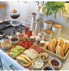 an assortment of food is displayed on a kitchen counter