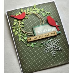 a close up of a card with a snowflake and two birds on it