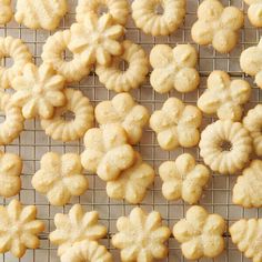 some cookies are cooling on a rack and ready to be baked in the oven for consumption