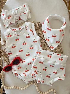 "Handmade Item Made in the USA Ships from La Mirada, California Smoke free environment The cutest little Cherries Bummies or Tank Bodysuit Set..  Made with custom organic knit cotton. The design is cherries (bright red) with white background.  super soft.  Bodysuit Set (Bodysuit, Bow (5\") or a TieKnot Headband (4\"x 26-30\" depending on the size you order) or  Bummie Set (Bummies, 5\" bow or TieKnot Headband with matching bandana Bib (4\"x26\"-30\" depending on the size you order)." Sweet Cotton Onesie For Summer, Sweet Summer Cotton Onesie, Sweet Cotton Onesie For Playtime, Cute White Diaper Cover For Summer, White Cotton Diaper Cover For Summer, Cute White Summer Diaper Cover, Playful White Diaper Cover For Summer, Casual Cotton Diaper Cover For Playtime, White Casual Diaper Cover For Spring