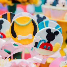 mickey mouse cake pops are on display for the guests to enjoy at their birthday party