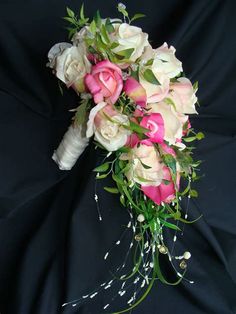 a bridal bouquet with pink and white flowers