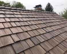 the roof of a house with wooden shingles