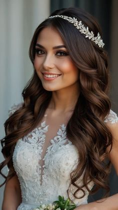 a woman in a wedding dress with long hair and a tiara on her head