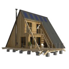 a wooden house with solar panels on the roof and stairs leading up to the second floor