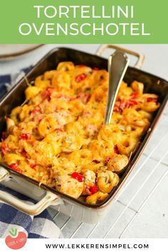 a casserole dish with tortellini and cheese in it on a table