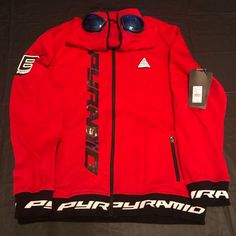 Black Pyramid Zip Up Hoodie W/Goggles Functional Red Hoodie For Winter, Functional Red Winter Hoodie, Functional Red Long Sleeve Hoodie, Red Sporty Outerwear For Skiing, Sporty Red Tops For Outdoor Activities, Sporty Red Skiing Outerwear, Red Casual Outerwear For Skiing, Casual Red Skiing Outerwear, Casual Red Outerwear For Skiing