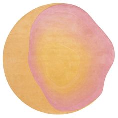 an orange, pink and yellow rug on a white background