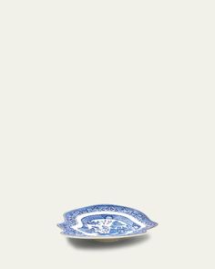 a blue and white plate sitting on top of a table