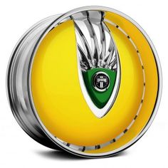 a yellow and silver object with a green emblem on it