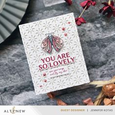 a card with the words you are so lovely printed on it next to some flowers