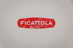 the word ficattola written in red ink on a white plate with a black border