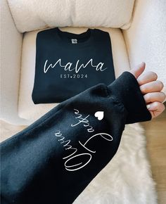 Custom Mama Sweatshirt with Children Name on Sleeve, Mama Sweatshirt, Gift for Mom, Mothers Day Shirt, Personalized Sweatshirt, Cool Mom Tee 🧺 Care Instructions: - Machine wash cold with mild detergent. - Tumble dry low or air dry. - Iron on low heat inside out. - Store in a cool, dry place away from sunlight. 🛒 How To Order: - Review the provided details before ordering. - Select the shirt type and size from the drop-down menu based on style. - Select the shirt color from the second drop-down Minimalist Mama, Idee Cricut, Cute Shirt Designs, Mama Sweatshirt, Custom Sweatshirts, Mom Sweatshirt, Mom Tees, Custom Hoodies, Mama Shirt