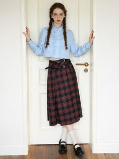 This is a Scottish skirt with a harmonious check pattern throughout. This skirt has a thick waistband, a simple two tuck on one side, and a pleated detail on the other, so you can style it to suit your desired mood. - Two sets of belt loops allow for unique expression with multiple belts.- Midi length allows for comfortable movement- Can be worn in any season Classic Pleated Plaid Skirt, Plaid Full Skirt For Work, Plaid Relaxed Work Skirt, Scottish Style Plaid Skirt For Fall, Scottish Plaid Skirt For Fall, Classic Plaid Skirt For Fall, Pleated Long Plaid Skirt, Fall Pleated Daywear Skirt, Fall Scottish Plaid Skirt