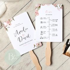 the wedding stationery is laid out on top of a table with scissors and other items