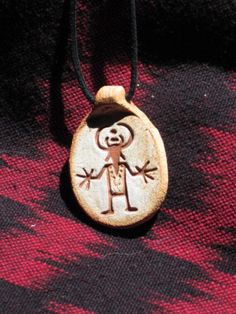 The Big Hands on this design motif seem to emphasize the power of this human Horned figure.  He was found up in the Capital Reef area of Utah and is from the Fremont culture Indian tribe.  Our pendants are made of highfired stoneware clay with a  impressed design that is stained and then fired on.  The pendant hangs on a 2mm black waxed cotton cord that can be adjusted for length. Our designs are inspired by ancient art found throughout the world. Many of the designs are depictions of petroglyph Man In The Maze, Big Hands, Indian Tribes, Basket Design, Art Pendant, Pottery Designs, Ancient Cultures, Stoneware Clay, Waxed Cotton