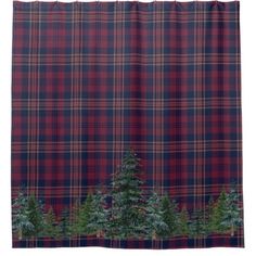 a red and blue plaid shower curtain with trees on the bottom in front of it