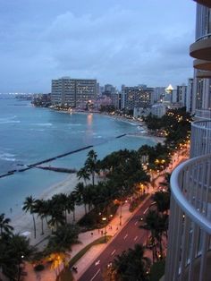 an ocean view from a high rise building at dusk