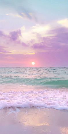 the sun is setting over the ocean with waves coming in to shore and pink clouds