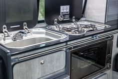 an oven and sink in a camper