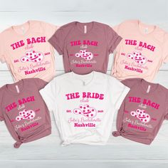 four shirts that say the bride and groom are in pink, white, and pink