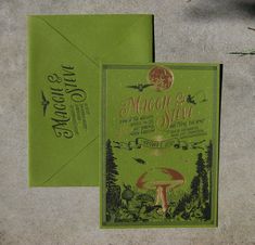 a green envelope with an image of a mushroom and forest scene on it next to a card