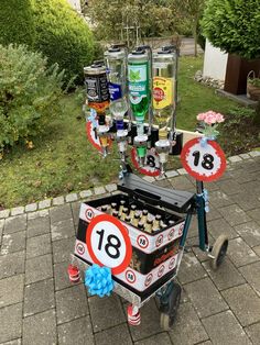 a cart that has some bottles on top of it and is decorated like a street sign